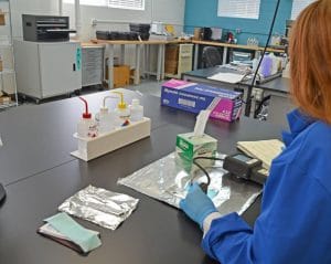 Woman in a lab testing materials